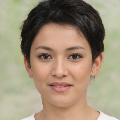 Joyful asian young-adult female with short  brown hair and brown eyes