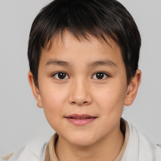 Joyful white child male with short  brown hair and brown eyes