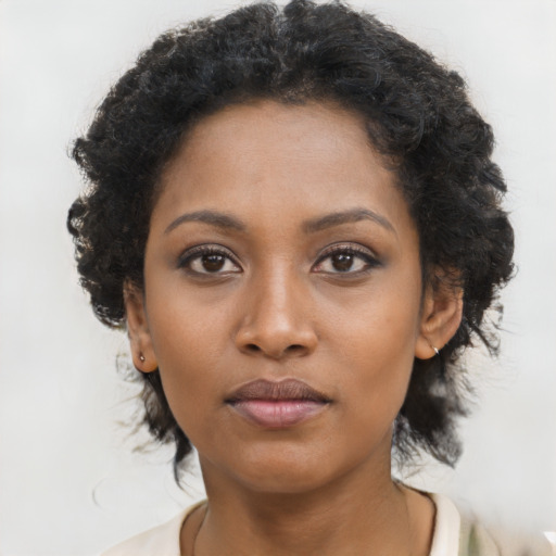 Neutral black young-adult female with short  brown hair and brown eyes