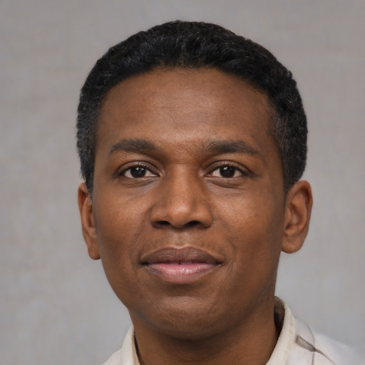 Joyful latino adult male with short  black hair and brown eyes
