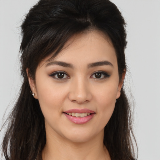 Joyful white young-adult female with long  brown hair and brown eyes