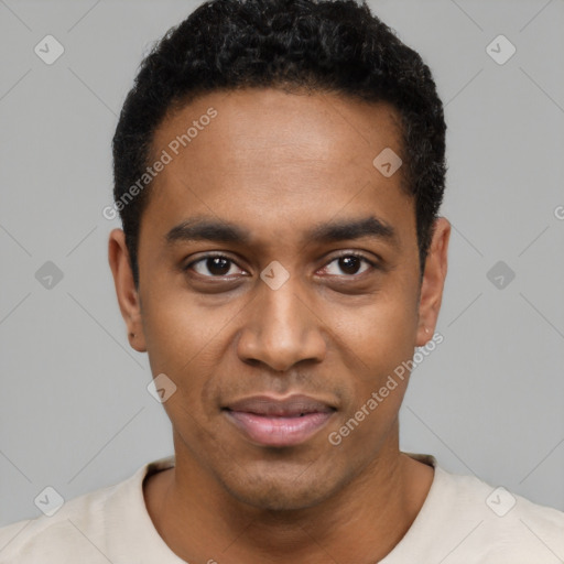 Joyful black young-adult male with short  black hair and brown eyes