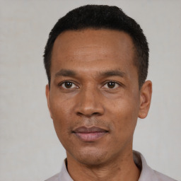 Neutral black adult male with short  black hair and brown eyes