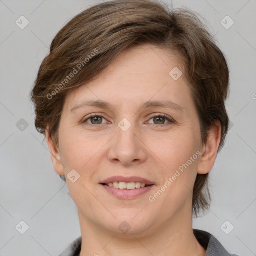 Joyful white adult female with medium  brown hair and grey eyes