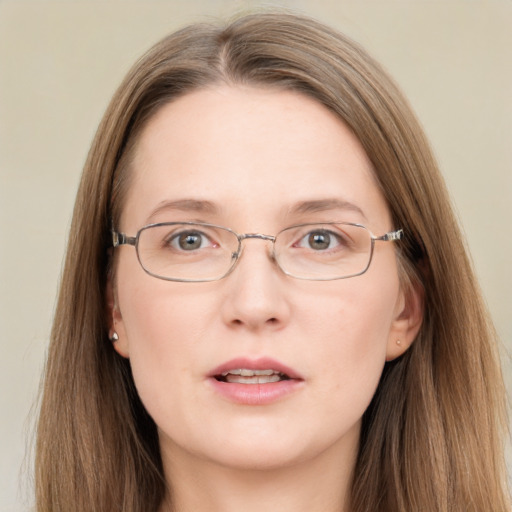 Neutral white adult female with long  brown hair and grey eyes