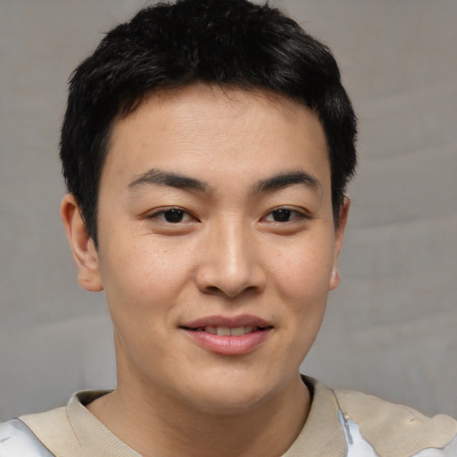 Joyful asian young-adult male with short  brown hair and brown eyes