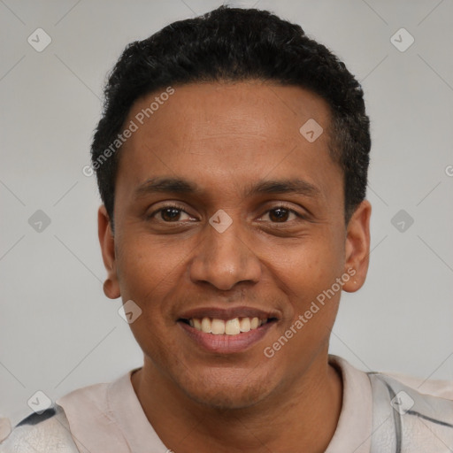 Joyful latino young-adult male with short  black hair and brown eyes