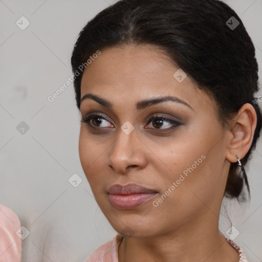 Joyful latino young-adult female with medium  brown hair and brown eyes