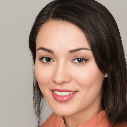 Joyful white young-adult female with medium  black hair and brown eyes