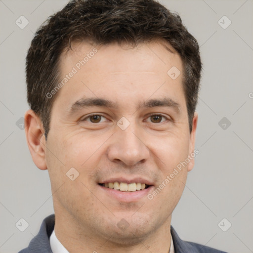 Joyful white adult male with short  brown hair and brown eyes