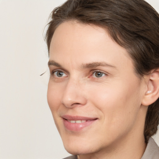 Joyful white young-adult male with medium  brown hair and brown eyes