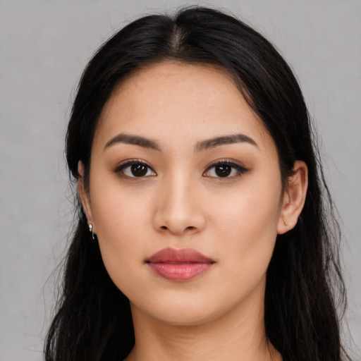 Neutral latino young-adult female with long  black hair and brown eyes
