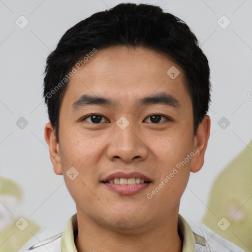 Joyful asian young-adult male with short  black hair and brown eyes