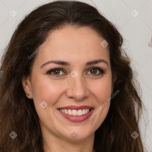 Joyful white adult female with long  brown hair and brown eyes