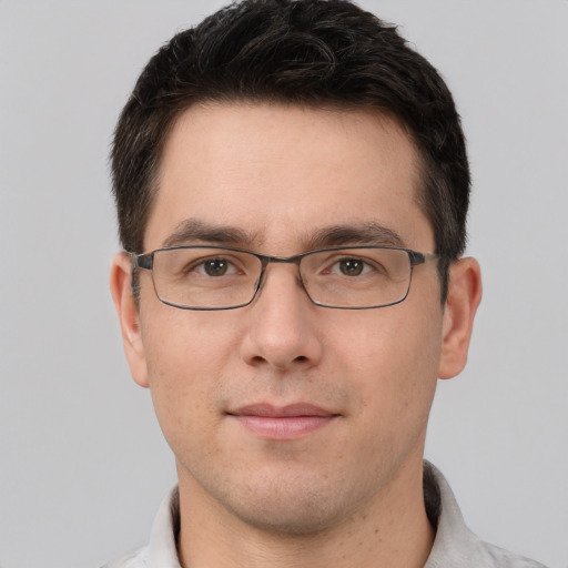 Joyful white young-adult male with short  brown hair and brown eyes