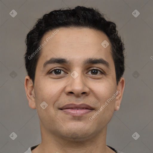 Joyful latino young-adult male with short  brown hair and brown eyes