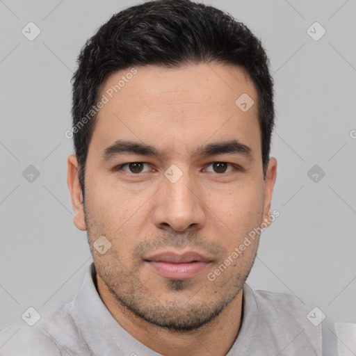 Joyful white young-adult male with short  black hair and brown eyes