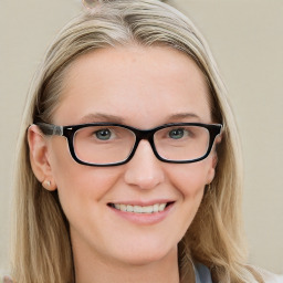 Joyful white adult female with long  brown hair and blue eyes