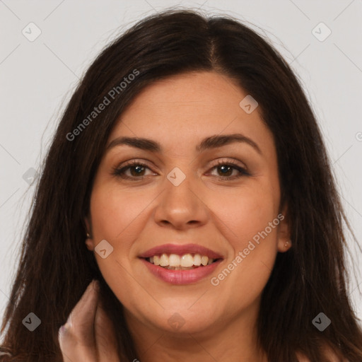 Joyful latino young-adult female with long  brown hair and brown eyes