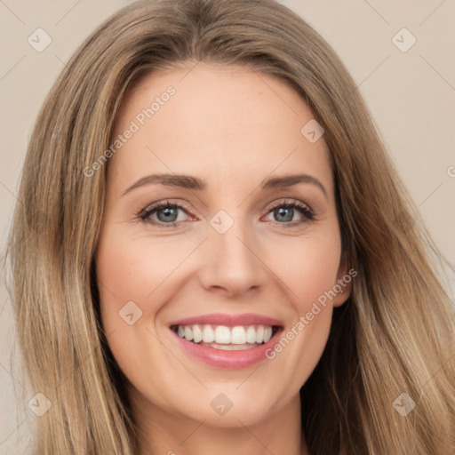 Joyful white young-adult female with long  brown hair and green eyes