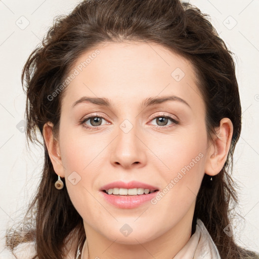 Joyful white young-adult female with long  brown hair and green eyes