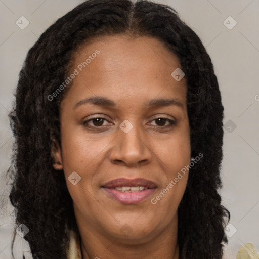 Joyful black young-adult female with long  brown hair and brown eyes