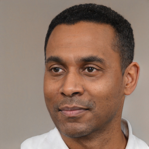 Neutral latino adult male with short  black hair and brown eyes