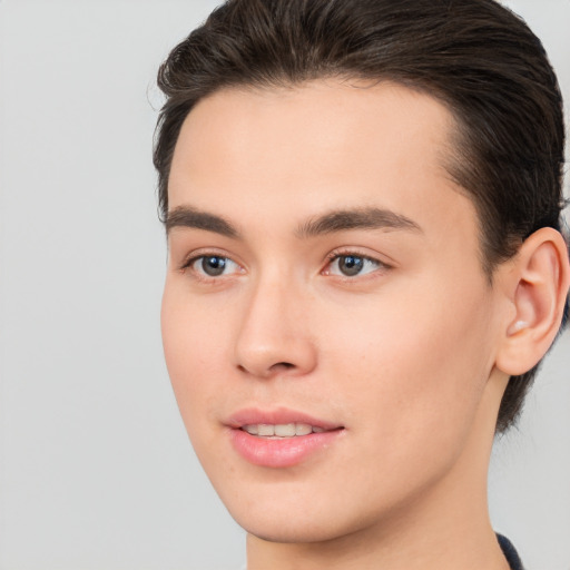 Joyful white young-adult male with medium  brown hair and brown eyes