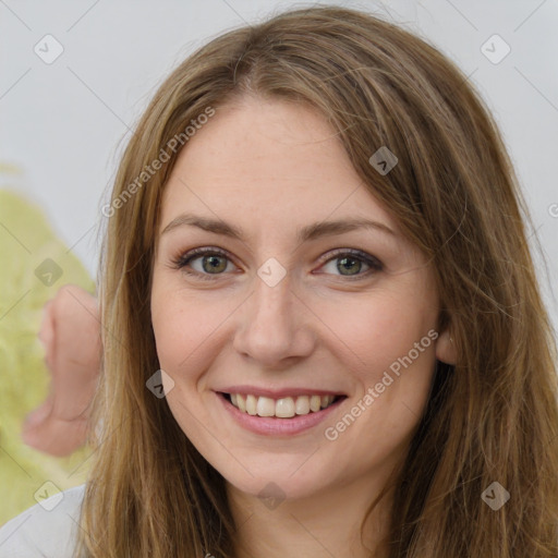 Joyful white young-adult female with long  brown hair and green eyes