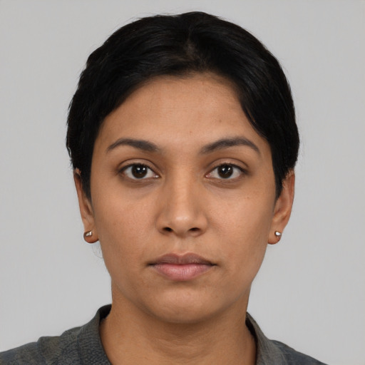 Neutral latino young-adult female with short  black hair and brown eyes