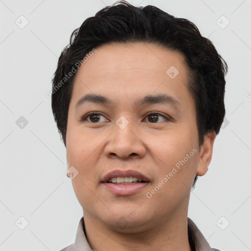 Joyful asian young-adult male with short  black hair and brown eyes