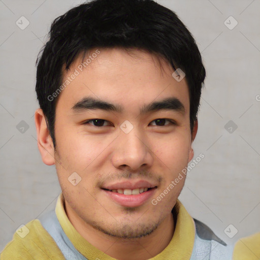 Joyful asian young-adult male with short  brown hair and brown eyes