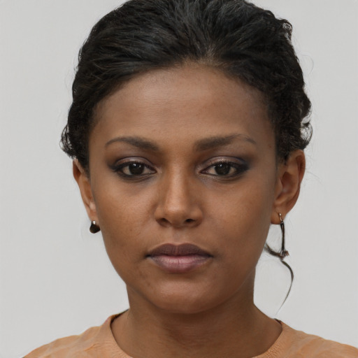 Neutral black young-adult female with short  brown hair and brown eyes