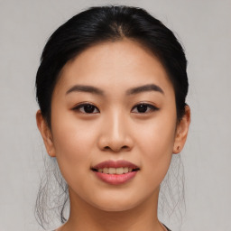 Joyful asian young-adult female with medium  black hair and brown eyes