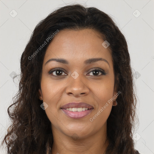 Joyful black young-adult female with long  brown hair and brown eyes