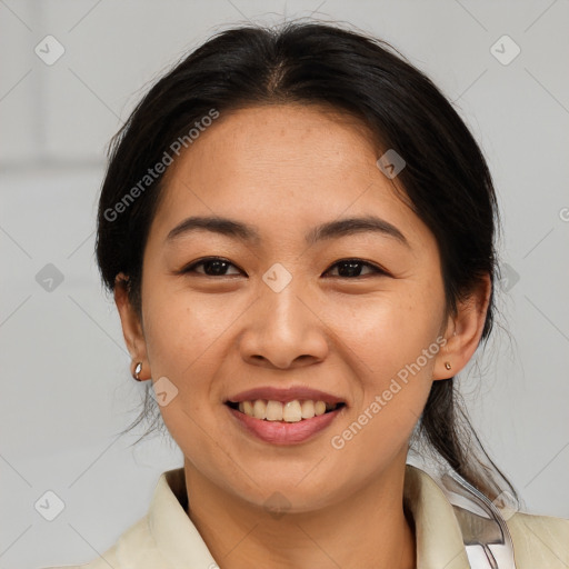 Joyful asian young-adult female with medium  brown hair and brown eyes