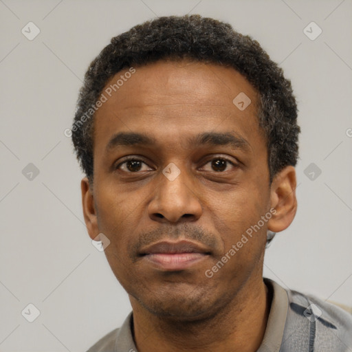 Neutral latino adult male with short  black hair and brown eyes