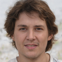 Joyful white young-adult male with medium  brown hair and brown eyes