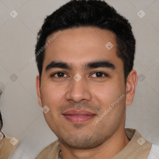 Joyful white young-adult male with short  black hair and brown eyes