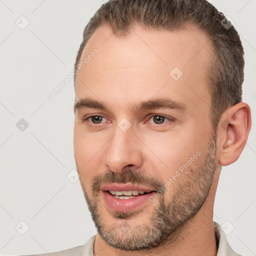 Joyful white young-adult male with short  brown hair and brown eyes