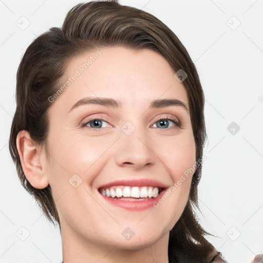 Joyful white young-adult female with medium  brown hair and grey eyes