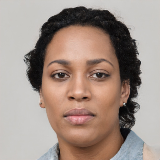 Neutral black young-adult female with short  black hair and brown eyes