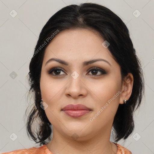 Joyful latino young-adult female with medium  brown hair and brown eyes