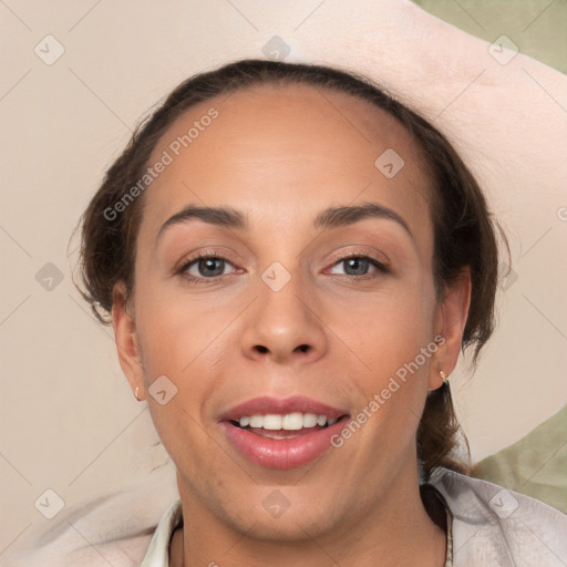 Joyful white adult female with short  brown hair and brown eyes