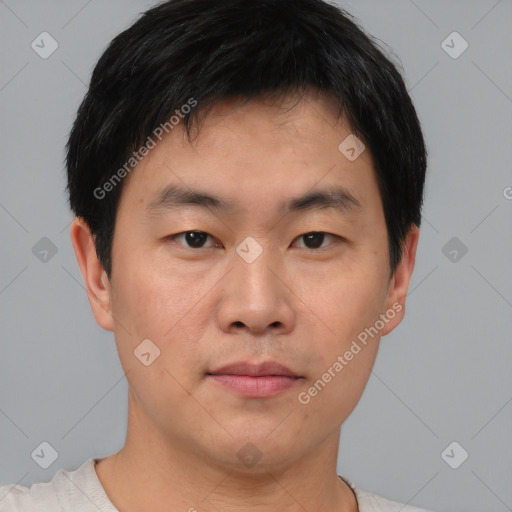 Neutral asian young-adult male with short  brown hair and brown eyes