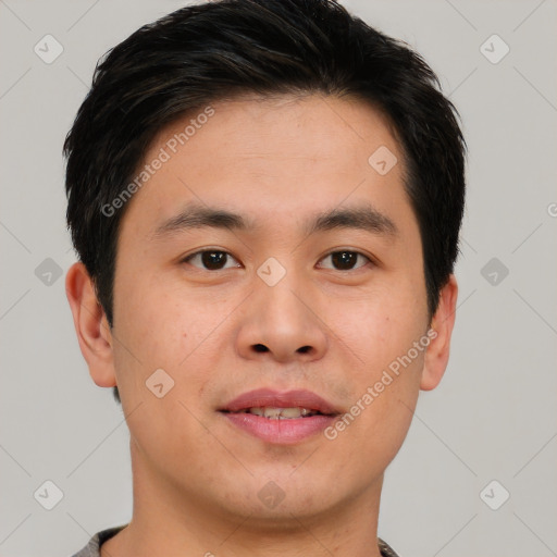 Joyful asian young-adult male with short  brown hair and brown eyes