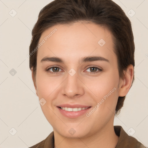 Joyful white young-adult female with short  brown hair and brown eyes