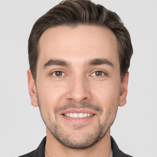 Joyful white young-adult male with short  brown hair and brown eyes