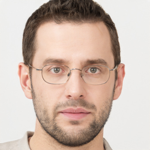 Joyful white adult male with short  brown hair and grey eyes