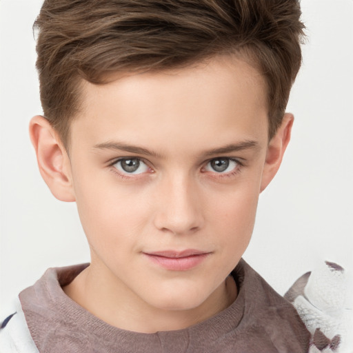 Joyful white child male with short  brown hair and brown eyes